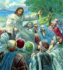 Jezus spreekt tot de mensen, zittend op een rots