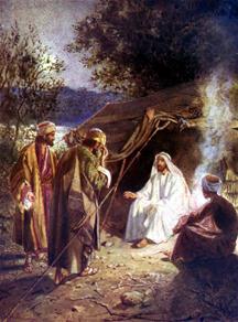Jezus zit buiten een tent aan een kampvuur en spreekt met zijn dicipelen